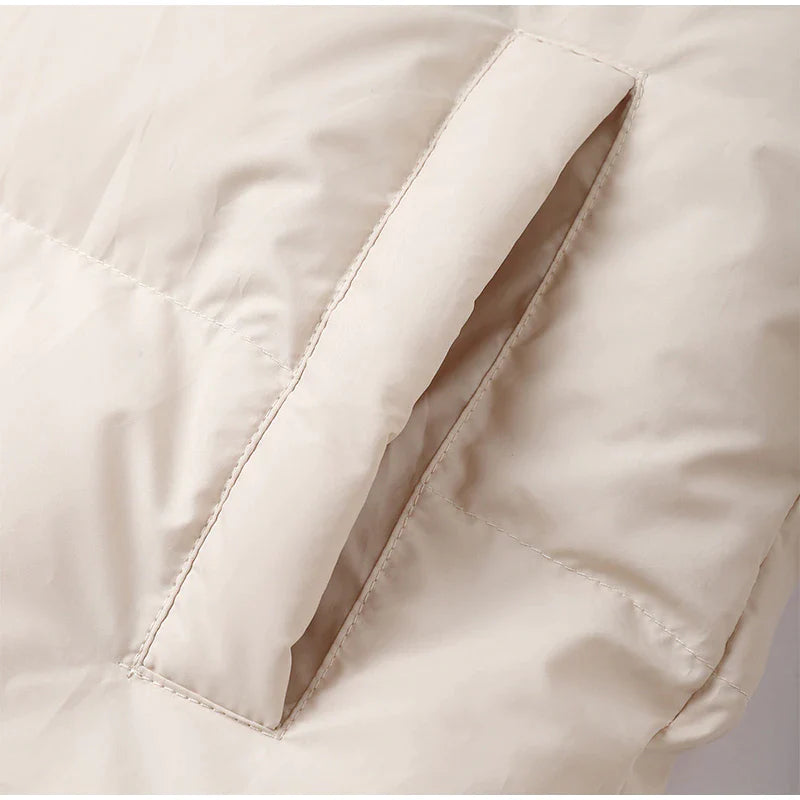 Długa damska zimowa kurtka z kapturem – ciepła, wiatroszczelna i modna