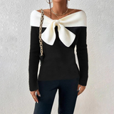 Sweter w serek z elegancką kokardą