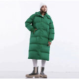 Długa damska zimowa kurtka z kapturem – ciepła, wiatroszczelna i modna