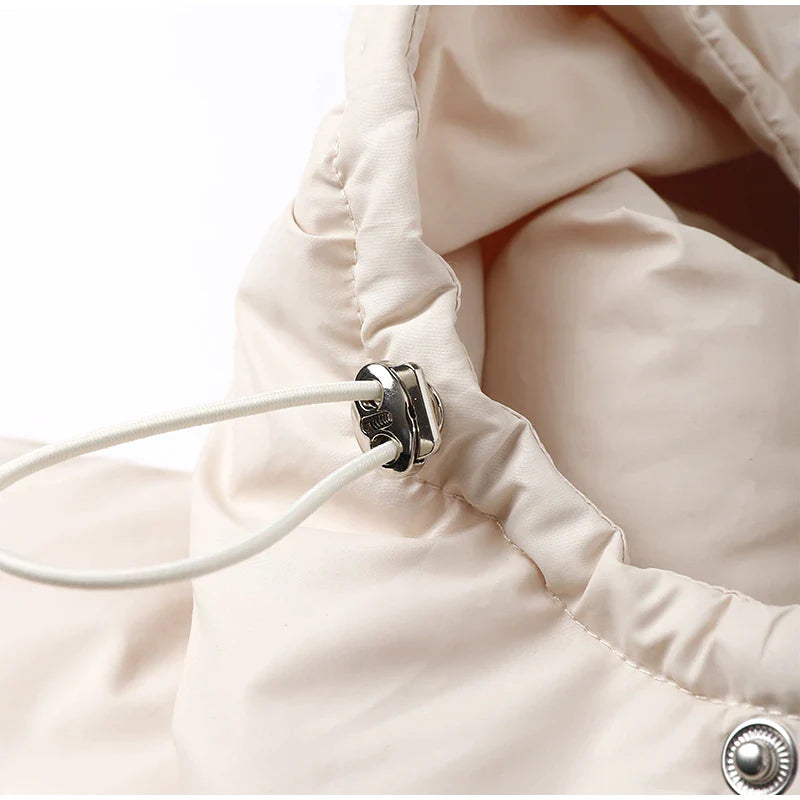 Długa damska zimowa kurtka z kapturem – ciepła, wiatroszczelna i modna